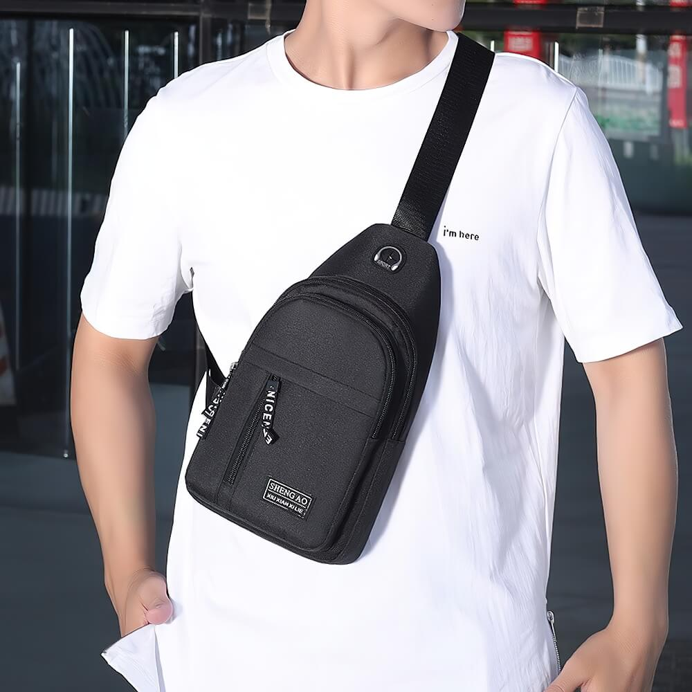 Fashionable man wearing small waterproof shoulder strap bag, perfect for outdoor adventures or urban commuting.